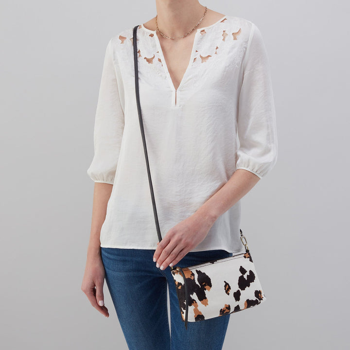 DARCY CROSSBODY COW PRINT